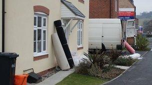 Carpets outside a house on the Glasdir estate