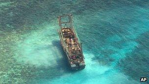 A Chinese fishing vessel is stranded after it ran aground at the Tubbataha reef in the Sulu Sea, Palawan province, 10 April 10 2013