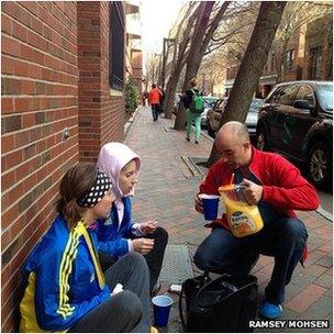 Ali Hatfield (sitting with friend) is given orange juice in Boston (Pic: Ramsey Mohsen)