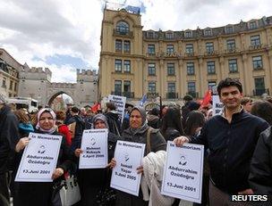 People hold placards with the names of victims of the neo-Nazi cell during a demonstration in Munich, 13 April