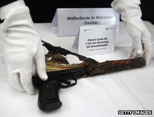 German police show the gun used in the murders to reporters in Karlsruhe, 1 December 2011