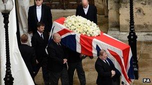 Lady Thatcher's coffin is carried by pallbearers