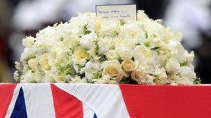 A note from Margaret Thatcher's children Mark and Carol rests on top of the flowers on her coffin