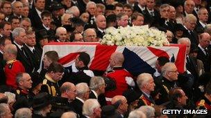 Lady Thatcher's coffin moves slowly down the central aisle of St Paul's Cathedtral