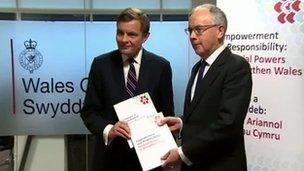 Paul Silk presents his report to Welsh Secretary David Jones