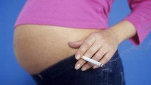 Pregnant woman with cigarette