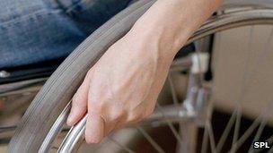 Hand on wheelchair