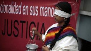 A protester outside court on 20 April 2013