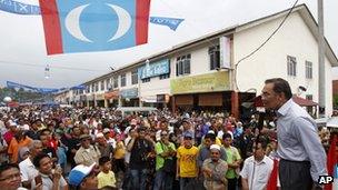 Malaysian opposition leader Anwar Ibrahim, right, speaks during an election campaign in Lubok China, Melaka state, Malaysia