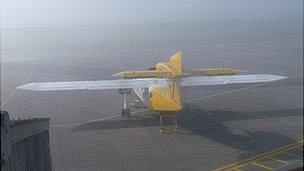 Plane at Alderney Airport in fog