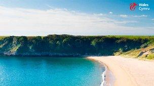 A poster of a Welsh beach to be used at Cardiff airport