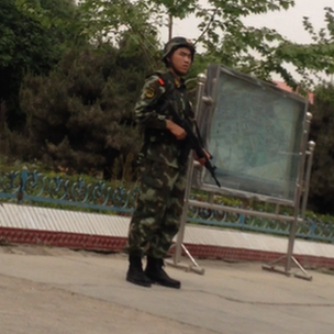 Armed paramilitary standing guard in Selibuya