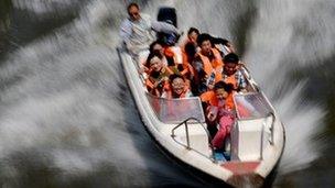 Chinese having fun in speedboat