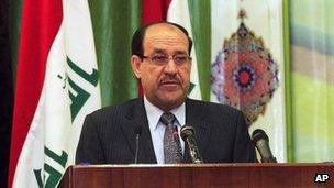 Nouri al-Maliki addresses a convergence of religions conference in Baghdad on 27 April