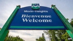 A French-English "welcome" signs in the Laurentian Mountains of Quebec