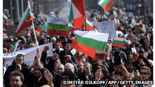 Protesting crowds wave Bulgarian flags in March