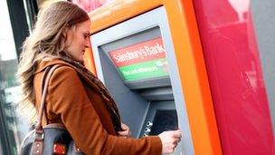 Customer using Sainsbury's ATM