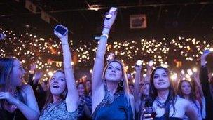 Crowd of people with mobiles