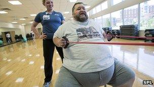 Obese man exercising