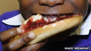 Child eating breakfast close-up