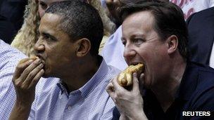 Barack Obama and David Cameron eat hot dogs at a basketball match - 13 March 2012