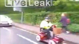 Mobility scooter escorted by Wiltshire police