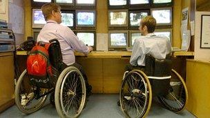 Remploy CCTV control room workers in wheelchairs, Clydebank, in 2004