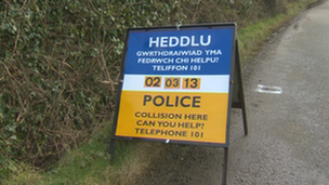 Police sign at scene of accident