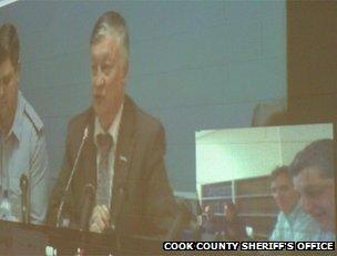 Anatoly Karpov appears on the screen at Cook County Jail, Chicago, 15 May