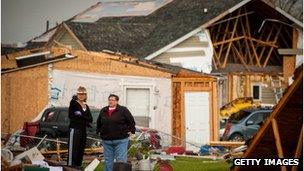 Residents look at destroyed property