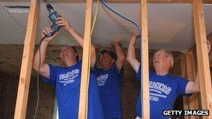 Representatives of Farmer's Insurance participate in a rebuilding event in Joplin.