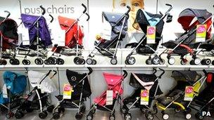 Pushchairs on sale at a Mothercare store