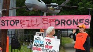 Protestors holding signs