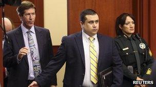 George Zimmerman arrives in court for a pre-trial hearing with his lawyer in Sanford, Florida 28 May 2013