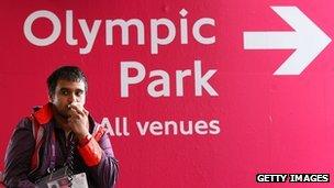 A steward directs spectators during the London 2012 Games