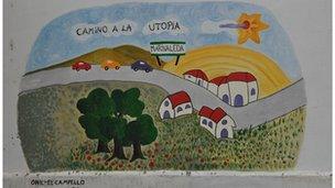 A mural in Marinaleda depicts cars on the "way to utopia"