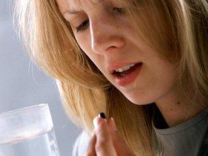 Woman taking medication