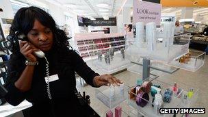 Woman works in a kiosk at Walgreens Pharmacy