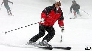 Russian President Vladimir Putin skies down a slope near Sochi. File photo