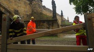 Emergency services erect metal barriers near the Charles Bridge in Prague on 2 June 2013