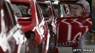 A technician assembles a Nissan car on the production line at Nissan's Sunderland plant in the UK