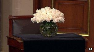 This video frame grab provided by C-SPAN2 shows a vase filled with roses on Senator Frank Lautenberg's desk