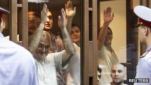 Some of the defendants inside the glass cage in court, 6 June