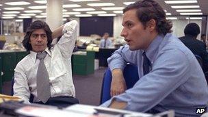 Reporters Bob Woodward (R) and Carl Bernstein (L) sit in the newsroom of the Washington Post in 1973