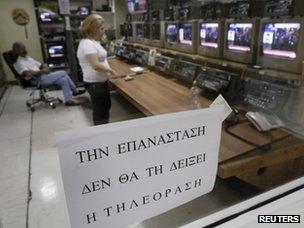 A poster inside ERT saying: "The revolution will not be televised"