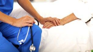 Generic image of nurse holding a patient's hand