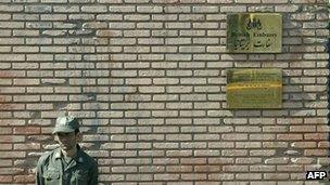 An Iranian soldier stands guard outside the British embassy in a file photo from 2005