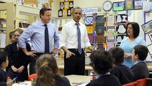 The two leaders helped pupils at Enniskillen Integrated Primary School paint a G8 banner