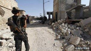 An opposition fighter on the outskirts of the city of Aleppo