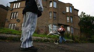 Children playing football in Glasgow street